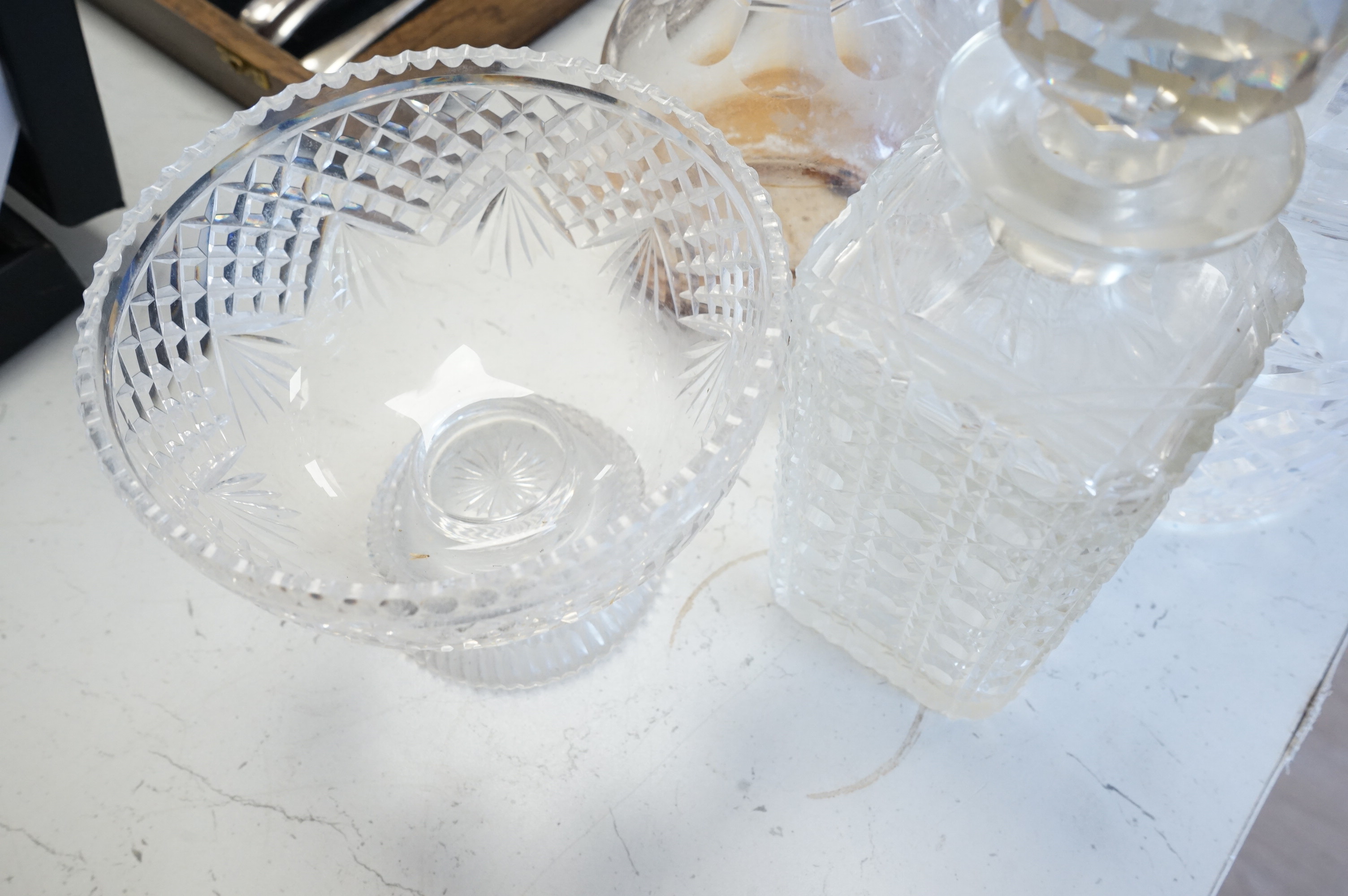 A collection of various cut glass to include decanters and a small pedestal bowl, largest 30cm high